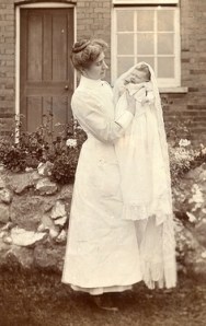 An Edwardian nurse with her young charge. Source: